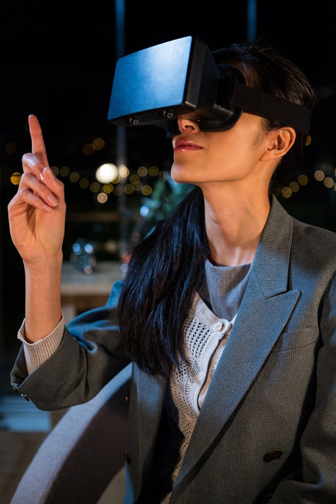 Businesswoman using virtual reality headset in the office