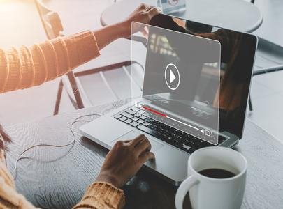 Boosting Association Member Engagement Through Strategic Podcasting Laptop displaying a podcast video play screen, symbolizing multi-channel content marketing to engage association member