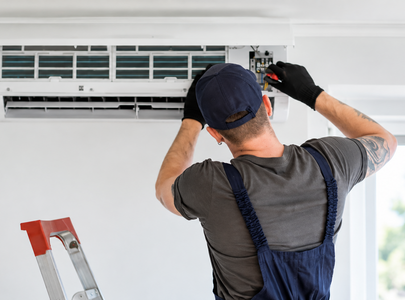 A technician working on an HVAC system.