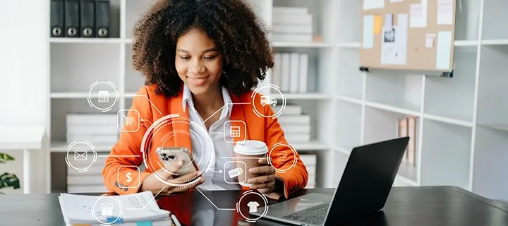 A person in an office looking at a smartphone