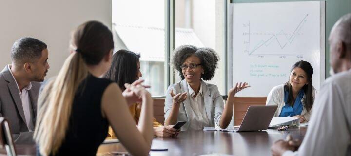 A group of people at a conference table.